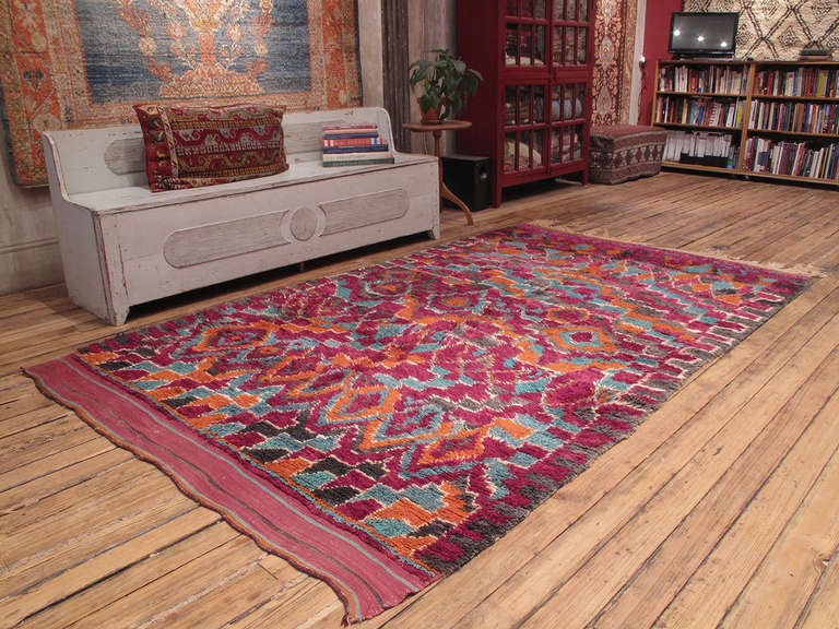 Woven by the Ait Bou Ichaouen, who inhabit the far eastern reaches of the country on the edge of the Sahara, this wonderful rug displays the characteristic exuberance and vibrant color palette of this tribes's weavings.

The most isolated of