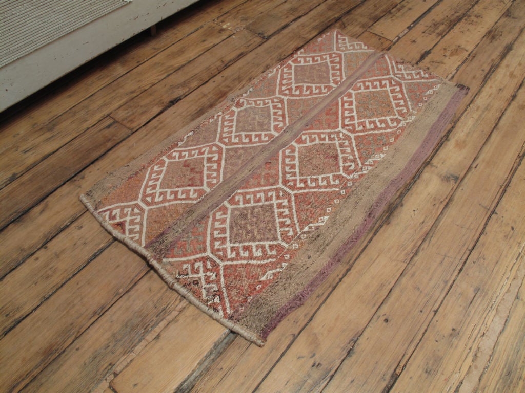 A tribal cargo bag from SE Anatolian nomads. These bags feature symbolic designs unchanged for generations. They can be used as floor rugs, wall hanging or can be stuffed to make cushions.