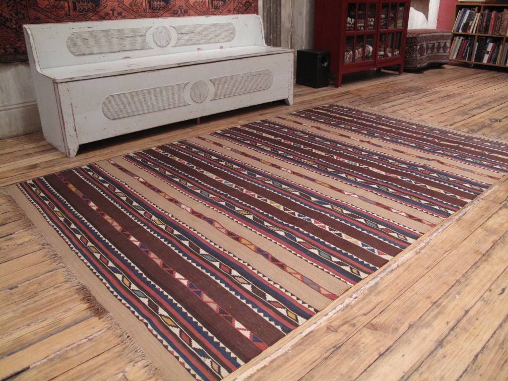 Antique Shirvan Kilim rug. A lovely antique Caucasian Kilim rug with a simple design and soft color palette - the soft brown bands are most likely un-dyed camel hair. Rug is very sturdy, clean and in excellent condition.