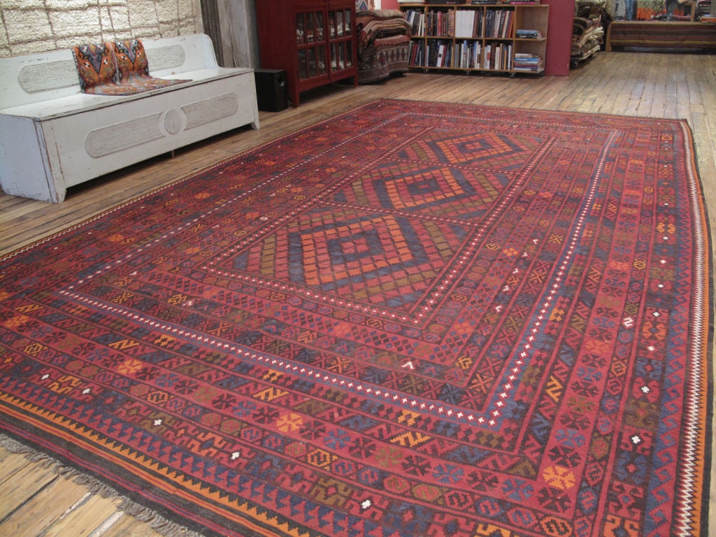 Large tribal Kilim rug by Uzbek weavers from Afghanistan. Very high quality wool and tight weave, not seen in lesser examples of this type of rug.