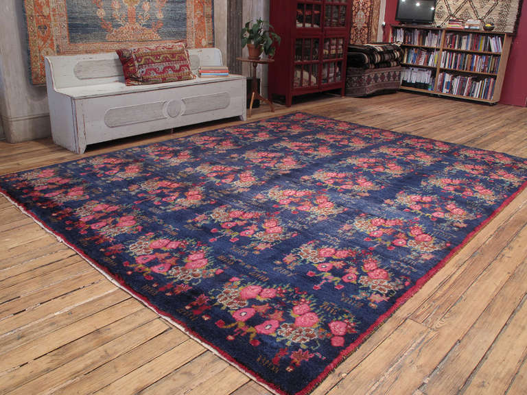 A truly unique and beautiful old carpet from East Central Turkey, woven in a rare large format. Realistic depictions of flowers are common enough but the composition and the color palette here are highly unusual and refreshingly contemporary. The