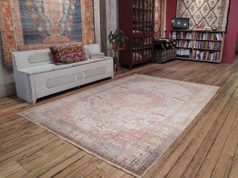 Animal hunting scenes, with lions and tigers chasing their prey, have always been among the most popular themes in carpet design. This beautiful old Turkish carpet displays a charming and playful take on this classical tradition.