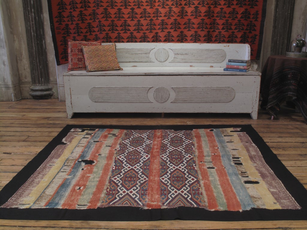 A very old tribal storage bag - opened and professionally mounted - with great colors and rare design. For the connoisseur. Despite the obvious wear, the piece is essentially complete. Ready for hanging.