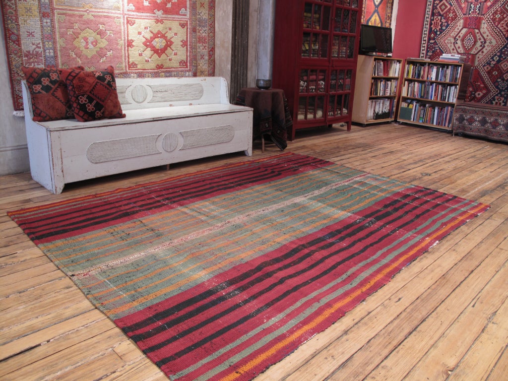 Pala Kilim rug. A very interesting example of this type of rug, woven with a mixture of cotton yarn, cotton rag and goat hair. The irregularities in the weave and dyes of this rug create a very pleasingly primitive effect.