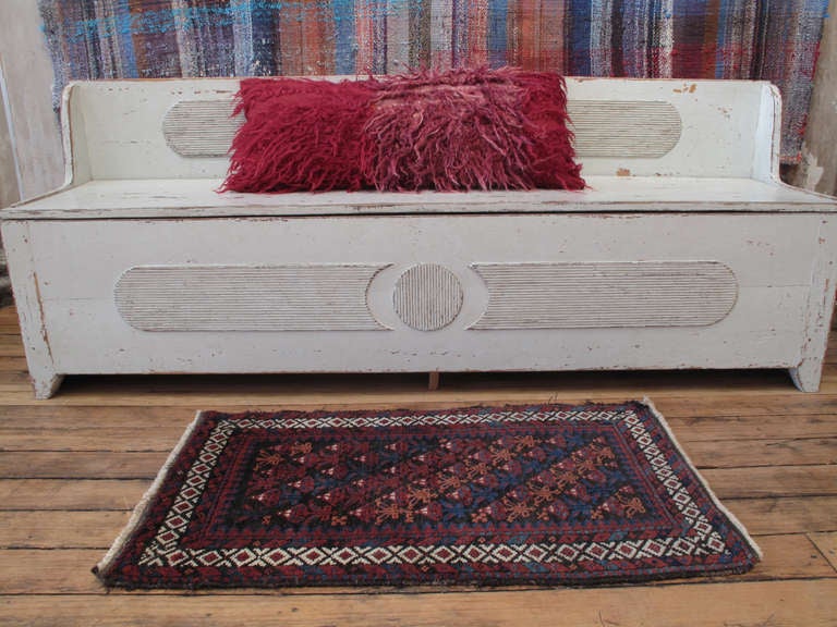 A wonderful example of tribal weaving in the Baluch tradition, in an unusual small format, but larger than the 