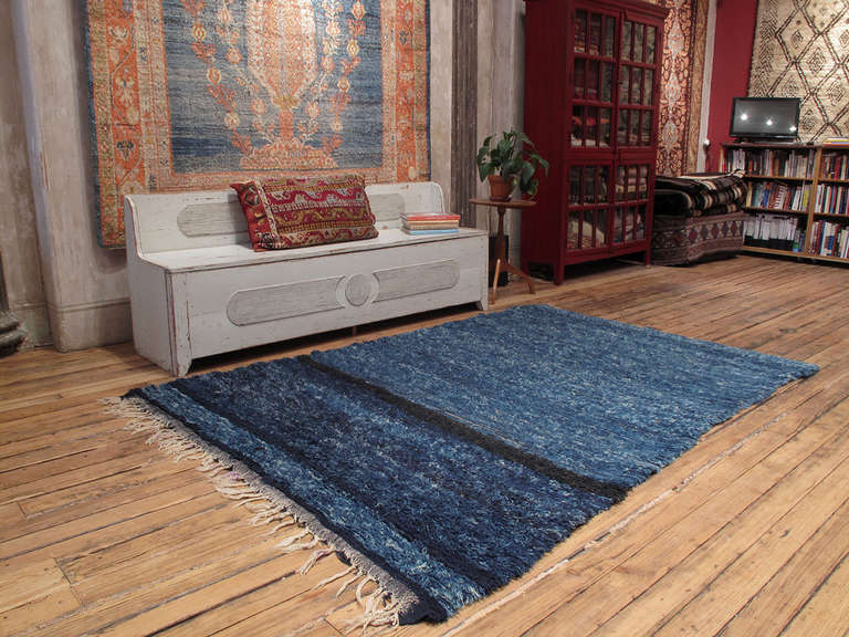 An older example of Moroccan Berber weaving by the Beni Mguild tribes of the Middle Atlas in highly saturated shades of indigo - this intense color is not found in later pieces.

The rug is loosely woven with not so high pile and it feels like a