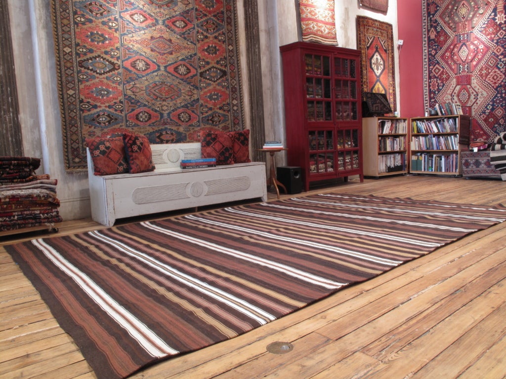 A large tribal floor cover, woven in narrow bands with goat hair, wool and cotton. (Size can be adjusted, please inquire.)