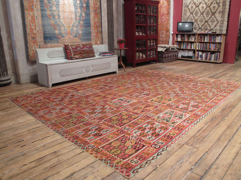 A lovely antique kilim from Eastern Turkey with a rare compartmental design with great colors and fine details.