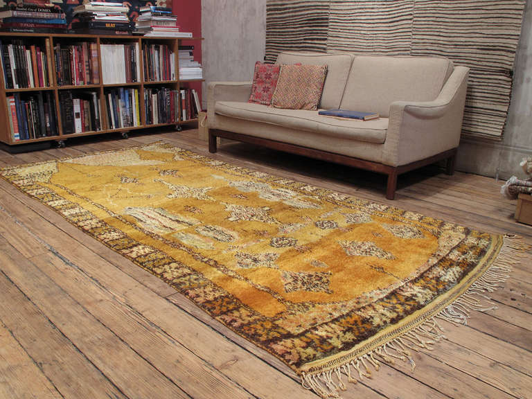 An old Moroccan Berber rug with a unique and whimsical design from the High Atlas Mountains. The weaving culture of this region has only attracted attention recently, making it difficult to attribute many pieces like this to specific tribes or