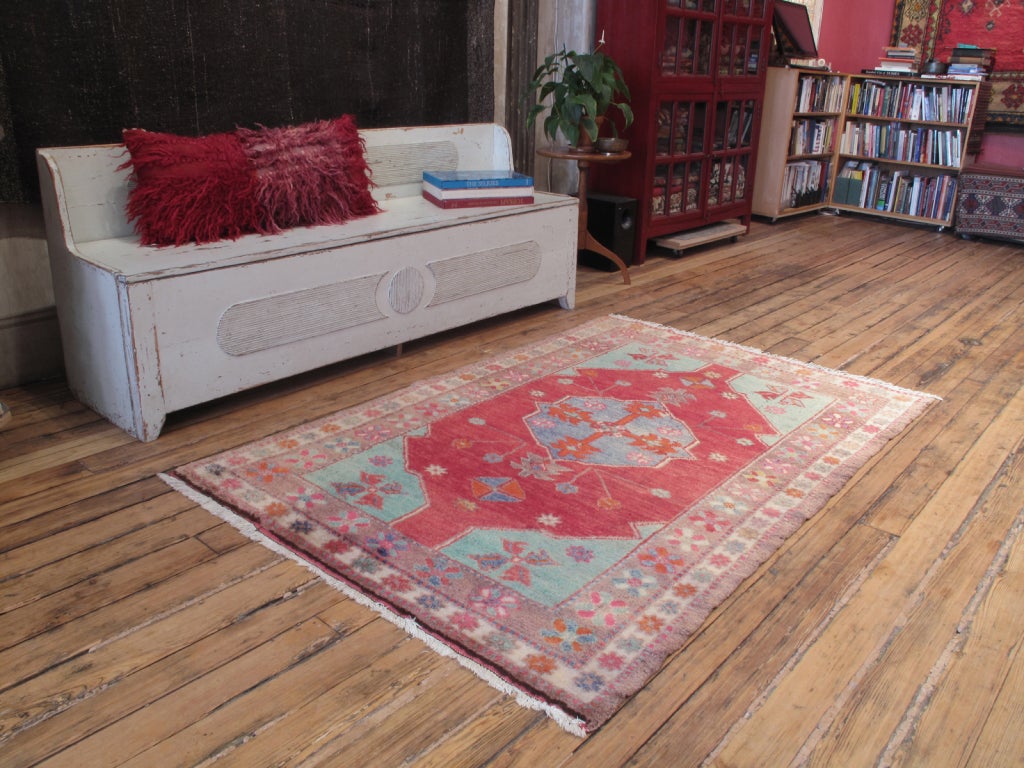 A very charming tribal rug from Western Turkey with cheerful colors and silky wool
