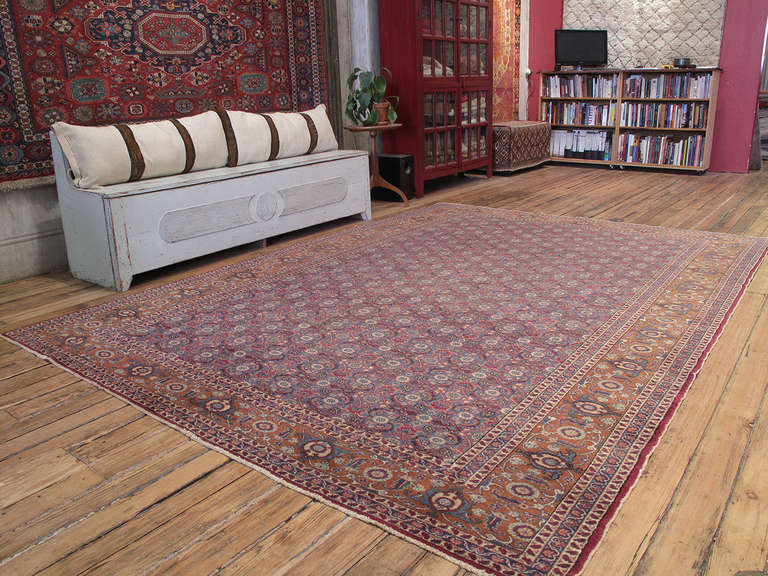 An old Turkish carpet with a classical design. Carpets like these were woven for the local market rather than export, often to much higher quality standards than what we see in modern production today. This is a very nice example with excellent wool