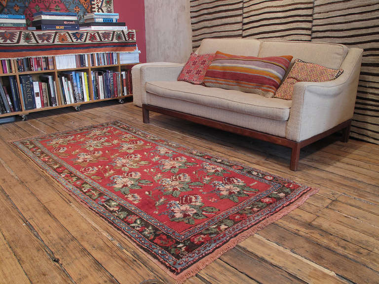 Roses of Karabagh rug. Realistically drawn floral designs in Karabagh, Armenia can be traced back to imperial Russian heritage of this prolific weaving region. This small rug is a particularly nice example of the type with a lovely color palette and