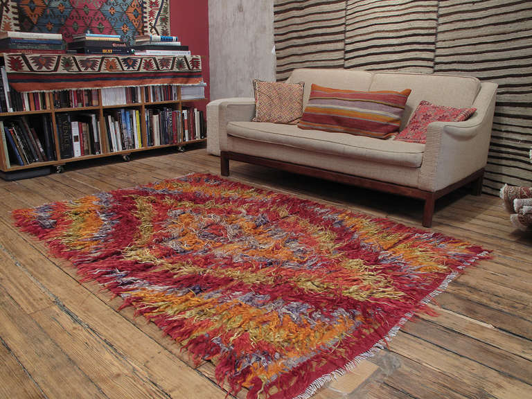 Diamond Tulu rug in angora. An old tribal rug from West Central Turkey, coarsely woven with long strands of colorful angora goat hair (mohair). Such rugs were used as beds, blankets and wall covers to provide warmth and comfort in village homes. The