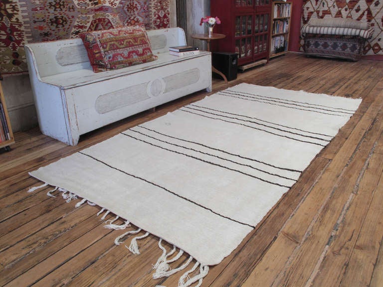 These kilims were intended for use in the fields during harvest time, to dry grains and fruits in the sun, acquiring a wonderful patina in the process. Feels like hand-spun old cotton. Wonderful texture and patina.
