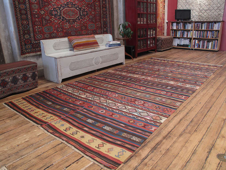 Antique Karabagh Kilim rug. A large antique flat-weave rug from the Karabagh region, SW Caucasus (present-day Armenia), which consists of two identical panels stitched together - a common method to weave large pieces on narrow looms. The design of