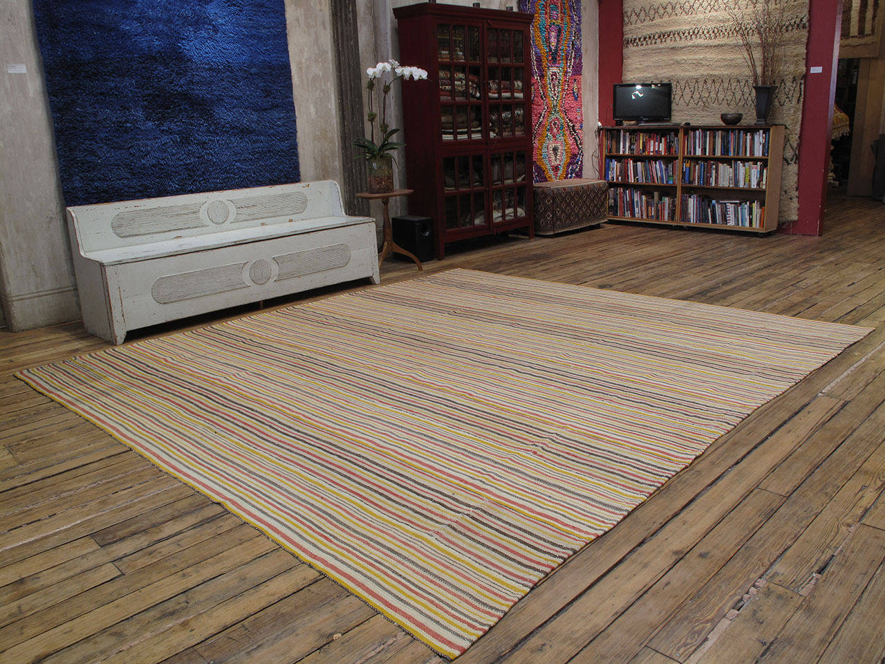 Large Striped Kilim rug. A large flat-woven floor cover or rug from Central Turkey, woven in narrow panels with colorful stripes. The structure is somewhat lightweight but it is a fairly sturdy weaving, suitable for moderate traffic.