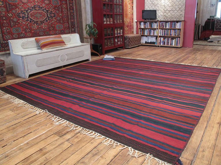 Large Bakhtiari banded Kilim rug. An unusually large Tribal flat-weave from Western Iran, probably by the Bakhtiari tribal groups there. A very sturdy Kilim with rich saturated colors in excellent state of preservation.