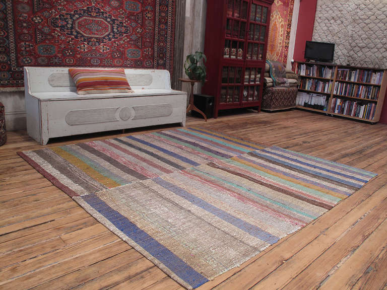 A very nice old flat-woven floor cover from Central Turkey made with an ingenious mixture of colorful cotton rag and goat hair. The seemingly random choice of colors and the irregular weave create a very painterly effect. Woven on a narrow loom, it