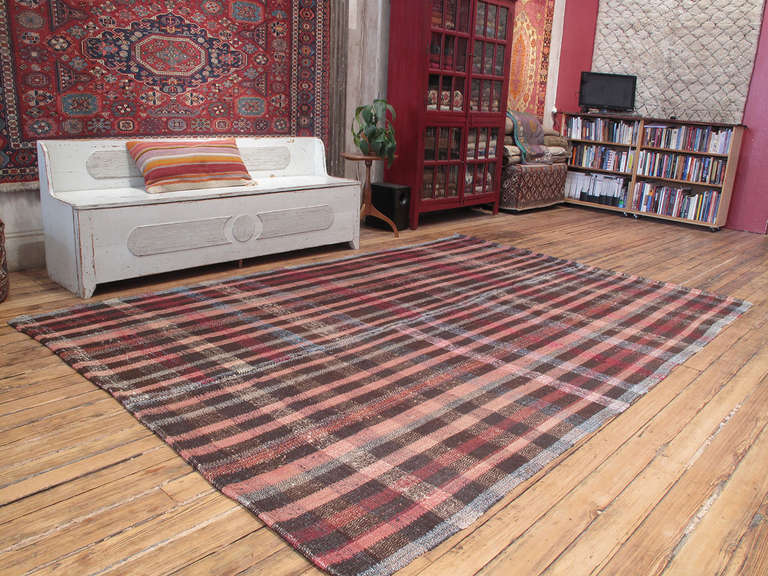 Pala Kilim rug. An old tribal floor cover or rug from Central Turkey, woven with an interesting mixture of cotton rag, wool and goat hair, creating a sturdy structure for everyday use. Large size for this type of rug.