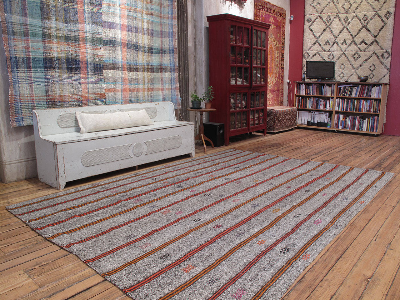An old tribal flat-weave from Southeastern Turkey, woven with a mixture of goat hair and cotton, embellished with brightly colored stripes and brocaded motifs. Pretty fancy for a humble floor cover.