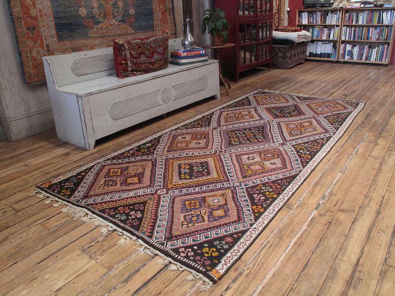Fantastic Kurdish Kilim rug. A great example of Anatolian Kurdish rug weaving from the Northeastern part of the country. Authentic weaving traditions survived well into the 20th century in these remote and isolated regions. Two columns of hooked