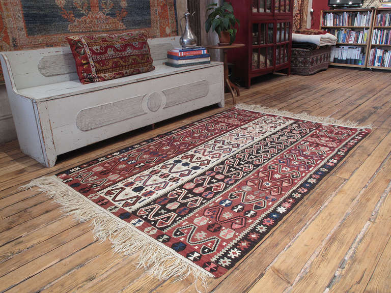 Kurdish Kilim rug. A lovely old tribal flat-weave rug from Eastern Turkey in a style attributed to one of the many Kurdish groups in that region. The restrained color palette of the rug includes lots of natural brown. The wool quality of the rug is