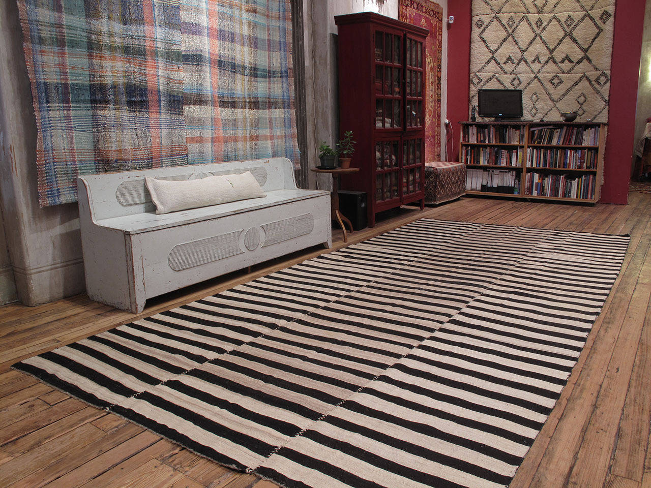 An old tribal floor cover from Northern Iran, woven in three narrow panels with alternating bands of ivory and dark brown or black. A strikingly modern look, with great texture and patina that cannot be replicated in contemporary weavings.
(Size