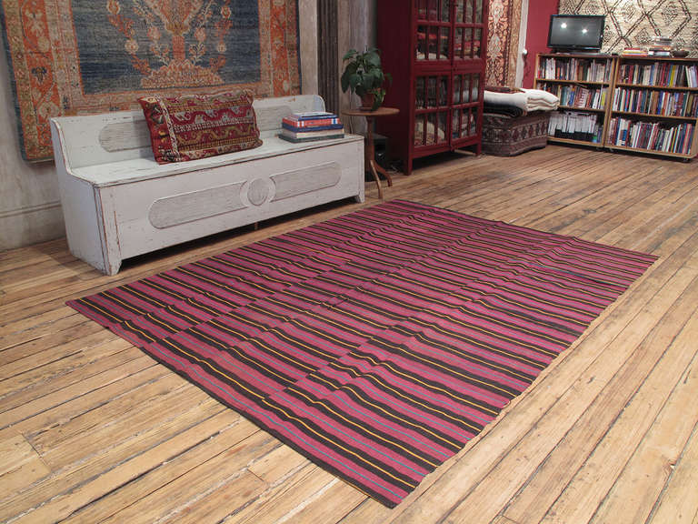 A lovely old flat-weave from Western Turkey, woven in panels on a narrow loom. It can be used as a floor cover in a low traffic area, but it is also light enough to be used as a bedspread. Great color variations and fantastic old patina.