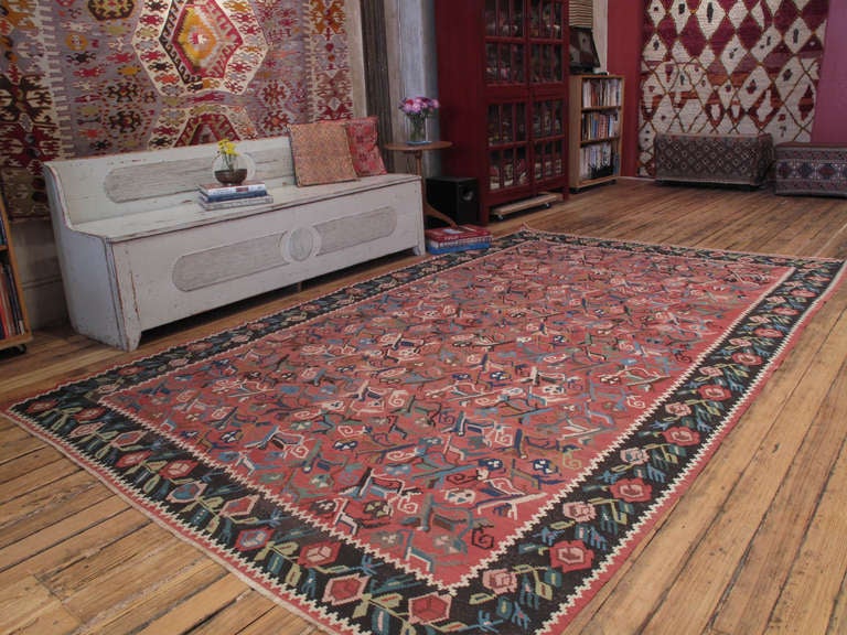Karabagh Kilim rug. Highly stylized floral designs in Karabagh, Armenia can be traced back to imperial Russian heritage of this prolofic weaving region. This is a particularly nice example of the type of rug with a lovely color palette and very