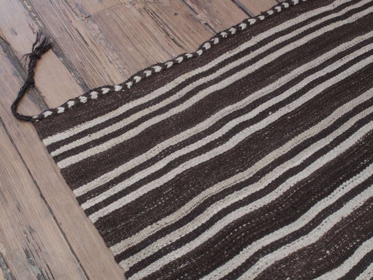 Banded Kilim wide runner rug. An old tribal floor cover runner rug, woven with natural dark brown wool and stripes in natural cream. Rug has great proportions and nice details. A very good example of the type.