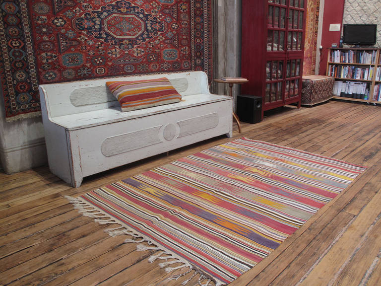 A lovely old flat-weave from the Southern western provinces of Turkey with a simple design and lovely colors.