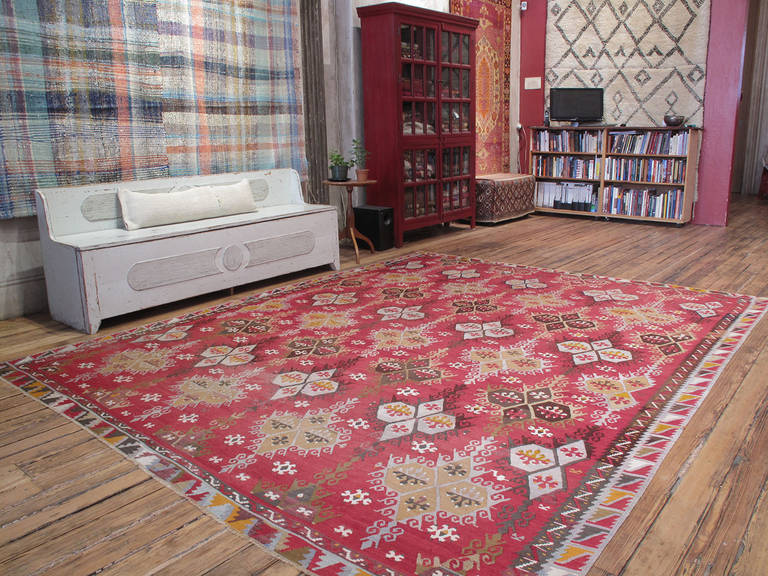 Antique Sharkisla Kilim rug. A large antique Kilim rug from Eastern Turkey. Such large Kilims were made by tribal weavers during the summer months when they could set up large looms outdoors and weave these for wealthy local patrons who favored
