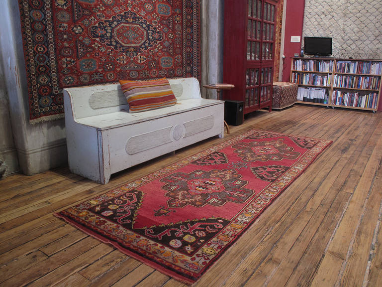 Konya long runner rug. A very nice example of 20th century village weaving from Central Turkey. The elongated format is typical, woven on traditionally narrow looms and used to cover the low built-in benches, called 