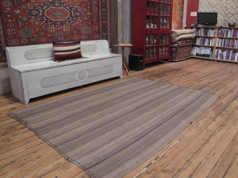 An old tribal floor cover from Southeastern Turkey, woven with wool in natural (no dyes) tones. A simple and beautiful weaving with immediate modern or contemporary appeal.