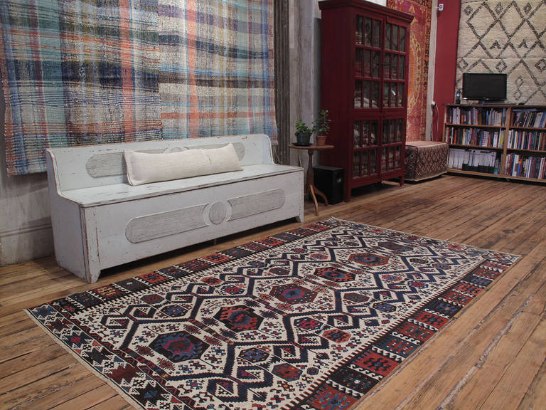 Antique Aydin Kilim rug. A very handsome example of Anatolian tribal weaving traditions, rug is attributed to the Aydinli nomads of Western Turkey. Woven in two symmetrical halves, a typical technique for nomadic weavers who used narrow looms, this
