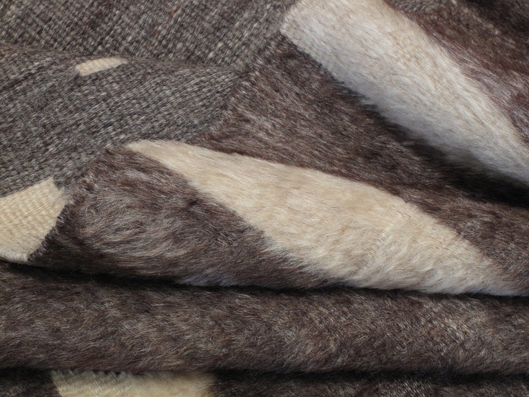 An old blanket from Eastern Turkey, woven in three panels on a narrow loom, featuring the symbols on the Turkish flag. The gray-brown color is natural and rare. Great patina and amazing quality weave.