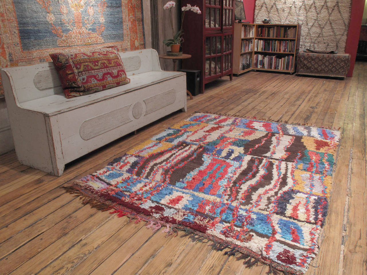 A Moroccan Berber rug from the Ourika Valley, woven with an ingenious mixture of wool, cotton and cut-up pieces of fabric from old clothes. A relatively recent phenomenon, such weavings are products of socio-economic changes in Moroccan society,