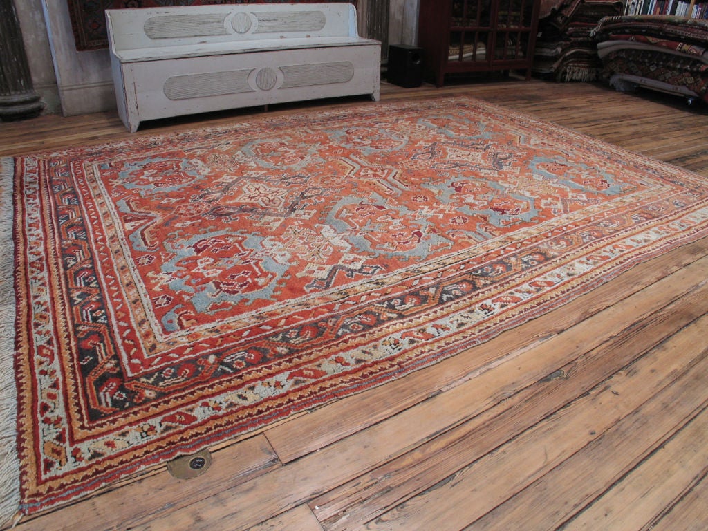 A very handsome antique Oushak carpet in very good condition. Lovely color palette (best seen in the detail pictures.)