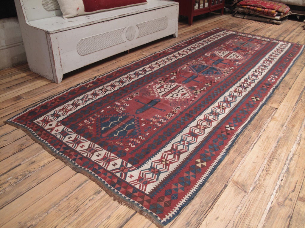 Antique Kagizman Kilim rug. An antique Kurdish Kilim rug with great design and colors.