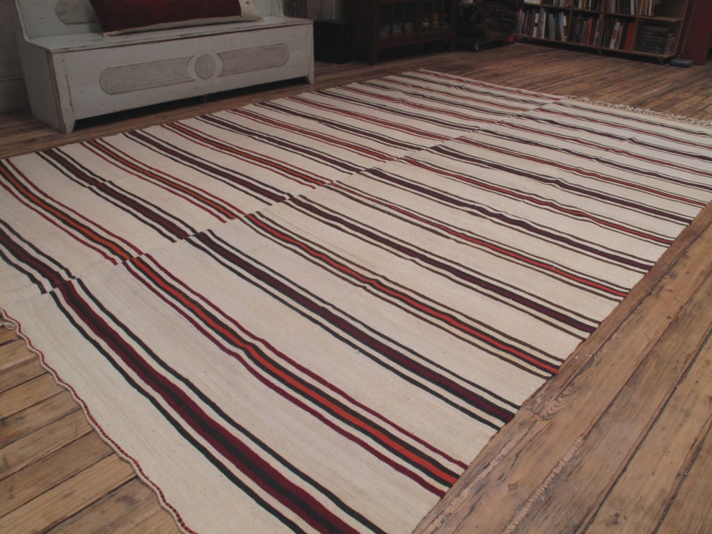 Large banded Kilim rug. A simple floor cover or rug from central Turkey, woven in two matching panels, which can be separated to make runners. Rare find and the colors of this rug are great.