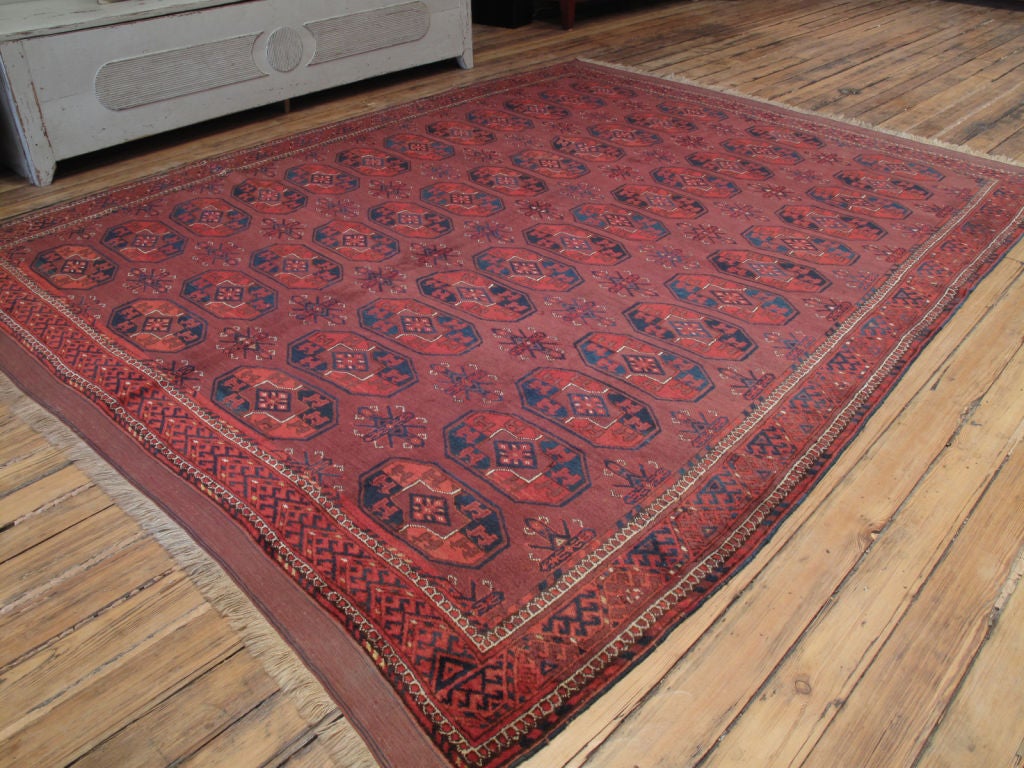 Turkmen main carpet or rug. A room-size tribal carpet, woven by the Kizilayak Turkmens. Almost old enough to be an antique, this carpet is preserved in very good condition.