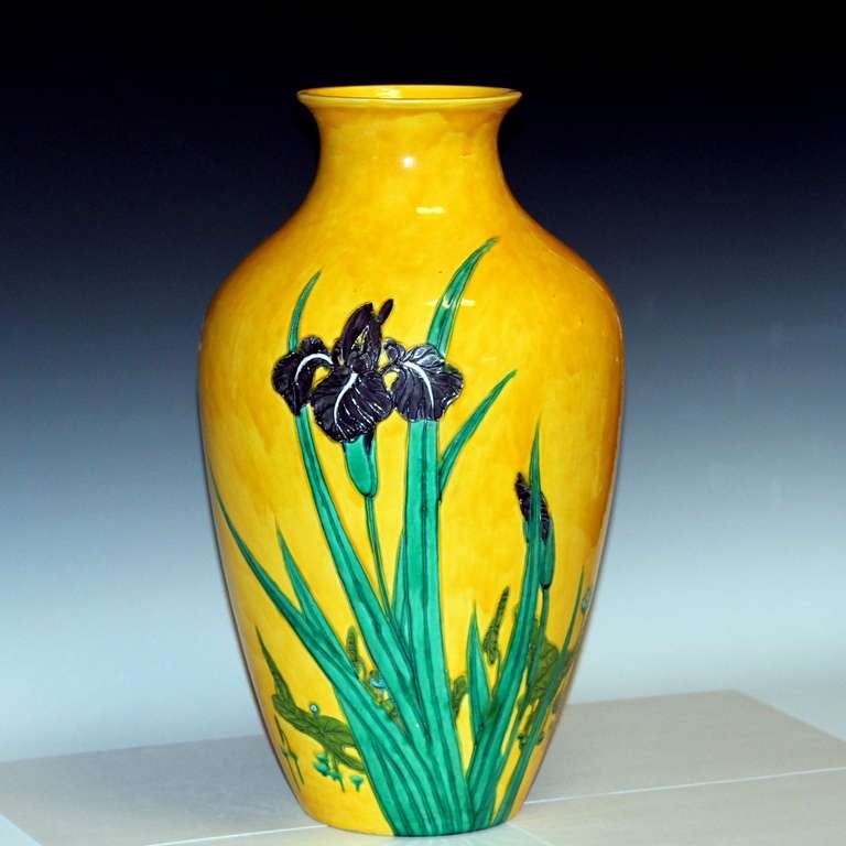 Large kutani vase decorated with irises in squeezebag enamels against a warm yellow ground.