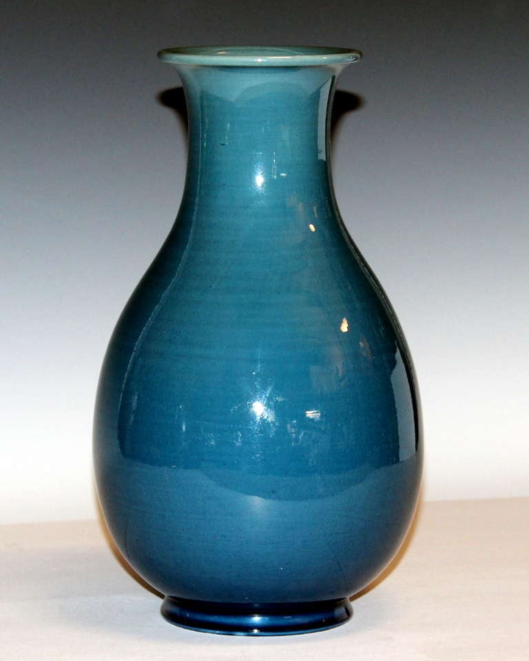 Awaji pottery vase in elegant tear drop form in dusty blue monochrome crackle glaze.