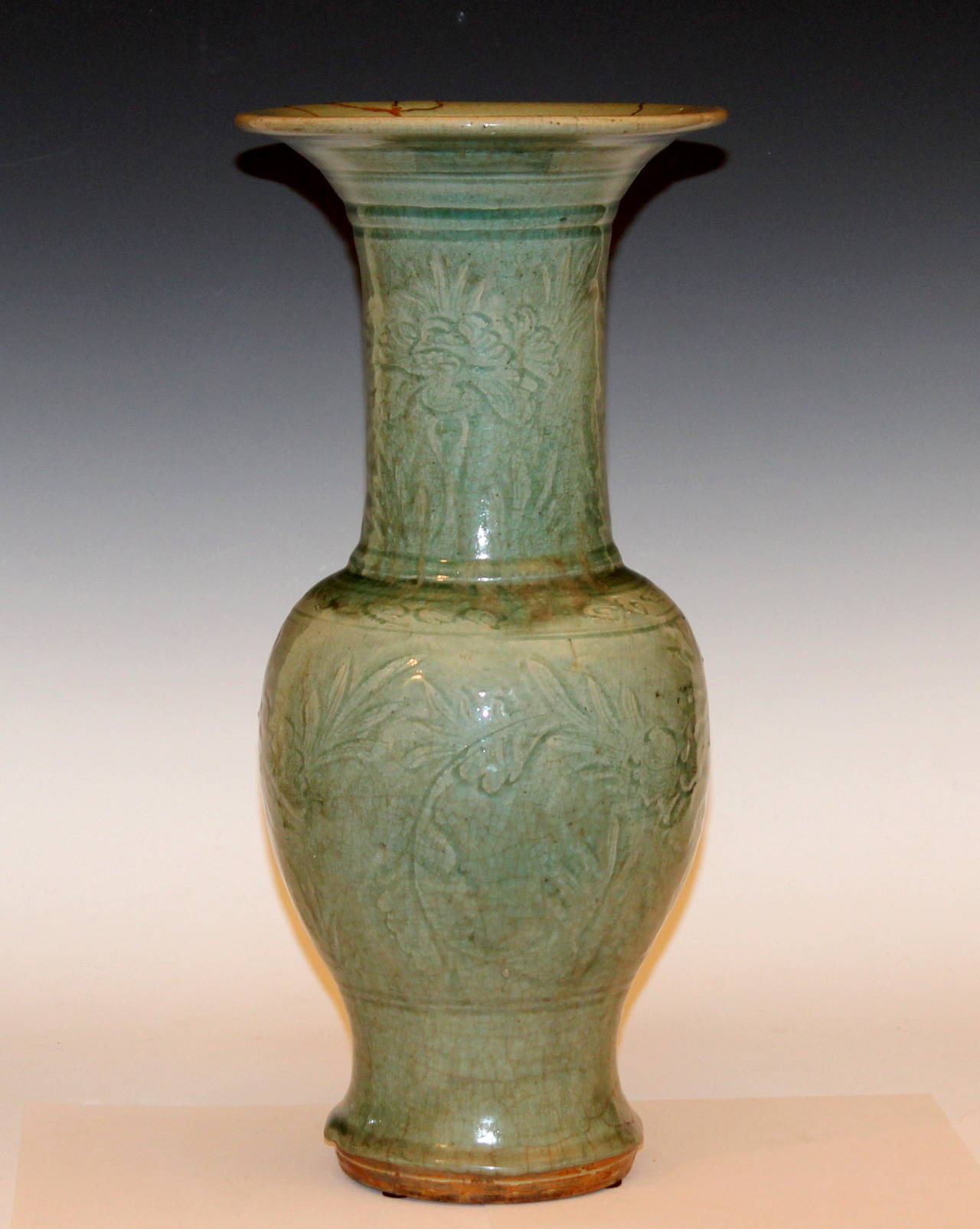 Large antique Chinese Ming dynasty celadon porcelain Yen Yen vase with carved peony scrolls, circa 15th-16th century. Nice Classic Chinese form. Very translucent blue/green crackled glaze with terrific 