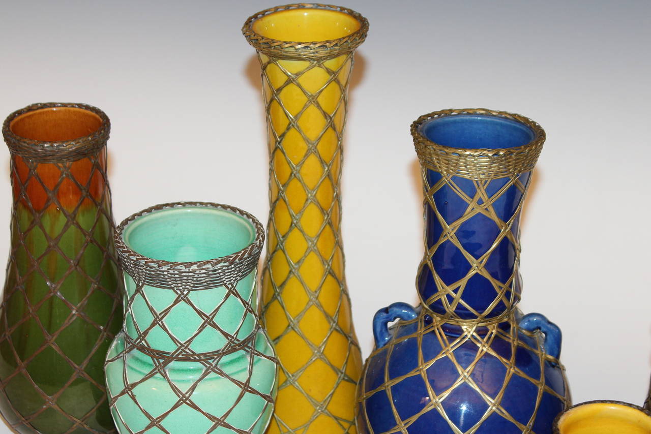 Collection of six Awaji Pottery vases with brass weaving, circa 1910. Measures 4