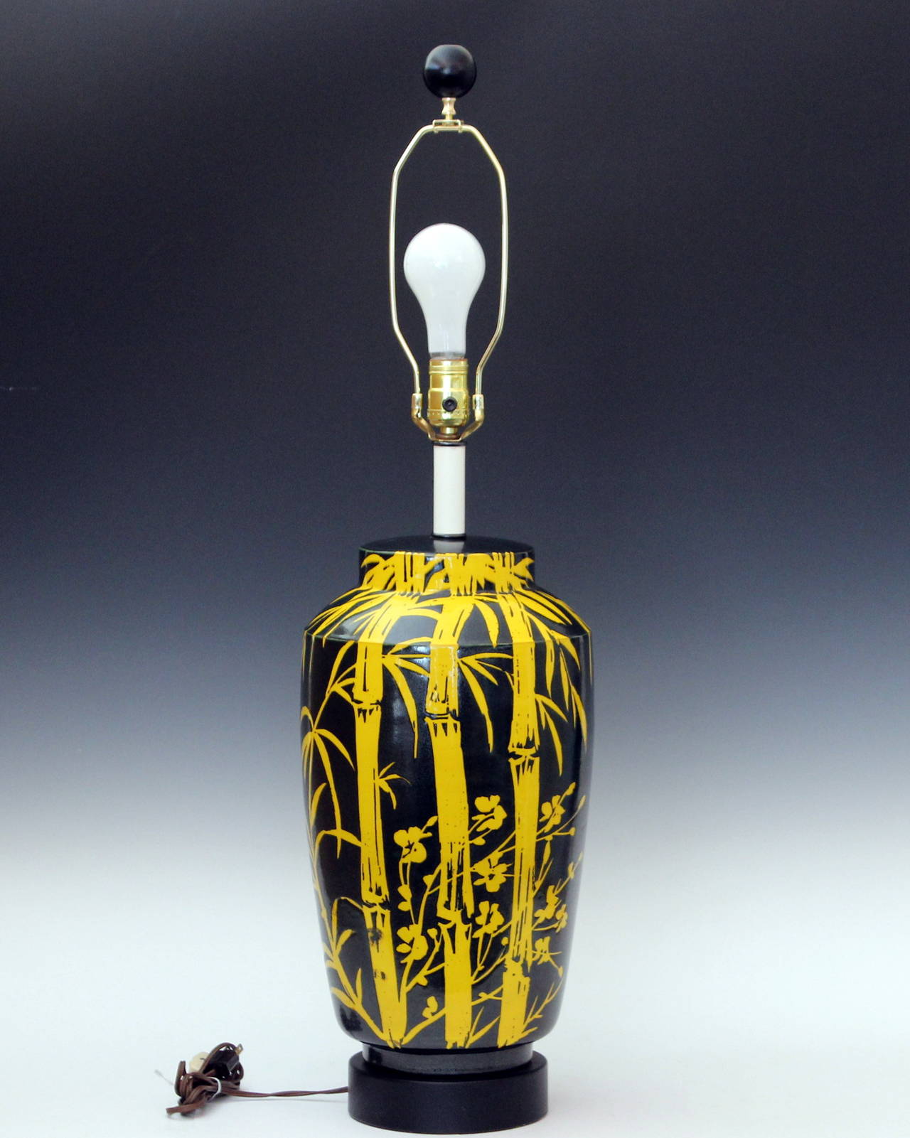 Striking Alvino Bagni pop art pottery lamp with wax resist bamboo design in metallic black on atomic yellow ground, 1960s. Great design executed to spectacular effect. Measures: 35