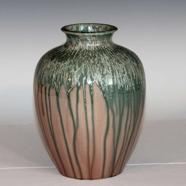 Vintage Awaji pottery vase in modified storage jar form with grey/green drip glaze shot through with silver and yellow crystals against a dusty rose colored ground. Impressed export, kiln, and potter's marks.