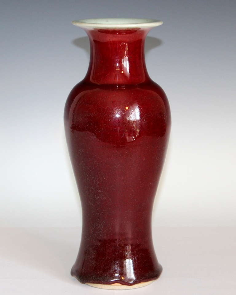 Antique Chinese ox blood vase in nice baluster form with terrific, bright red and crushed strawberry sang de beuf glaze. Fantastic, thick 