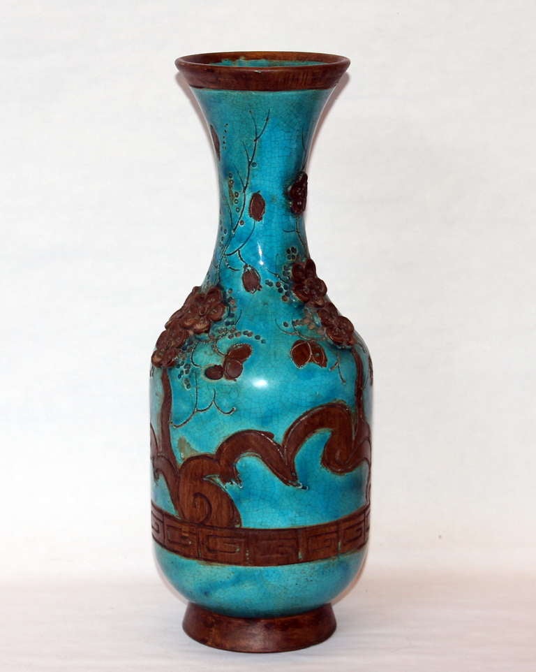 Vintage Zaccagnini Italian pottery in Asian style with applied and incised cherry or plum blossom sprays between Greek key borders. Mid 20th century. The decoration is left unglazed to show the dark bisque to great effect against a turquoise crackle