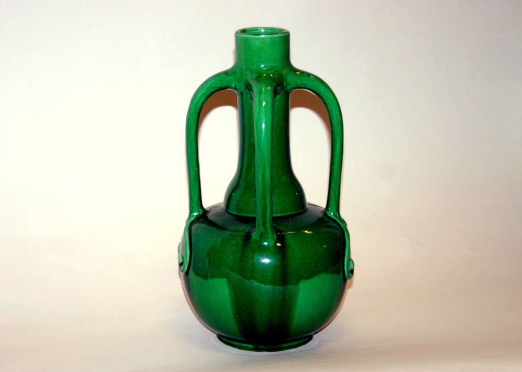 Japanese Awaji pottery vase in dramatic organic, art nouveau form with two pair of handles, one disappearing into the shoulder and the other terminating in whimsical tendrils.